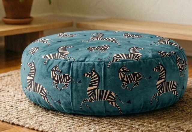 Close-up of the Dancing Zebra cushion's hand-screened zebra motifs