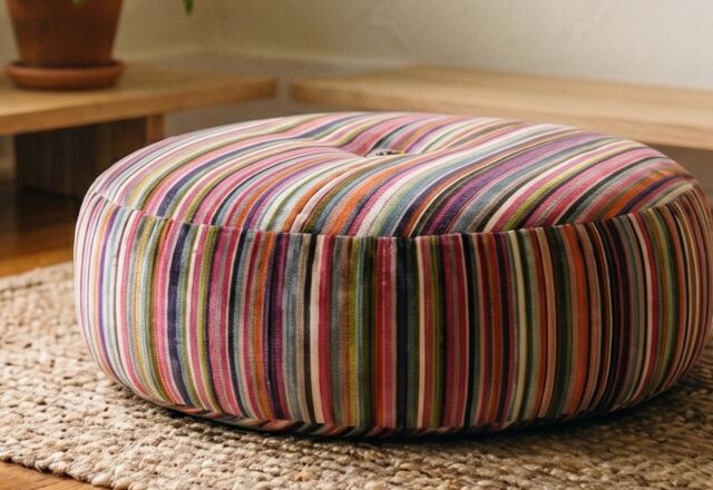 Close-up of the Mashru Stripe cushion's silk-cotton stripe weave